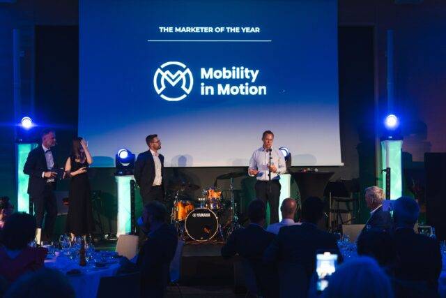 Managing Director of Mobility in Motion, Matt Fieldhouse on stage accepting 'Marketer of the year' award at BraunAbility Partner Conference.