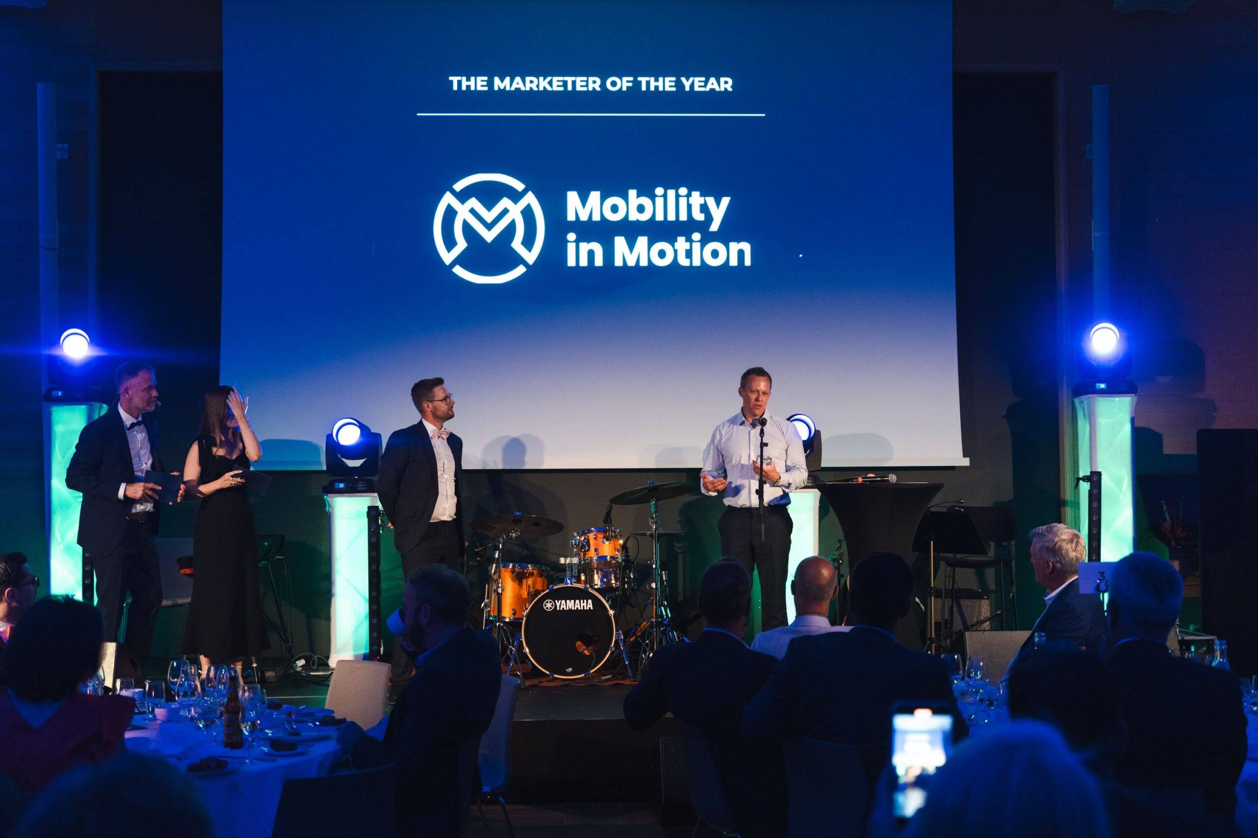 Managing Director of Mobility in Motion, Matt Fieldhouse on stage accepting 'Marketer of the year' award at BraunAbility Partner Conference.