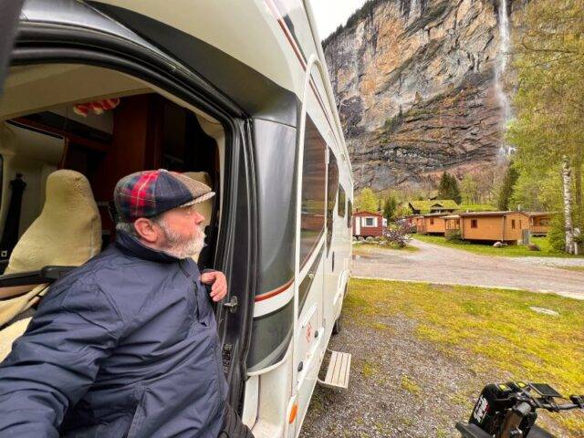 Paul Mahoney sat on his electric transfer plate in his RV at a campsite in Salzburg