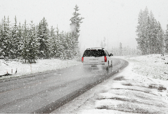 Prepare your vehicle for winter - car driving on snowy road